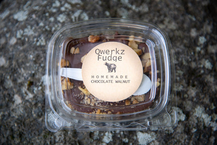 box of Qwerkz chocolate walnut fudge with a spoon in the package