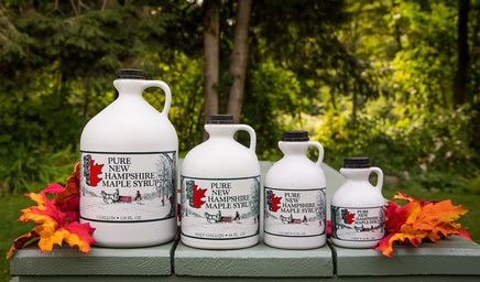 four different sizes of maple syrup bottles